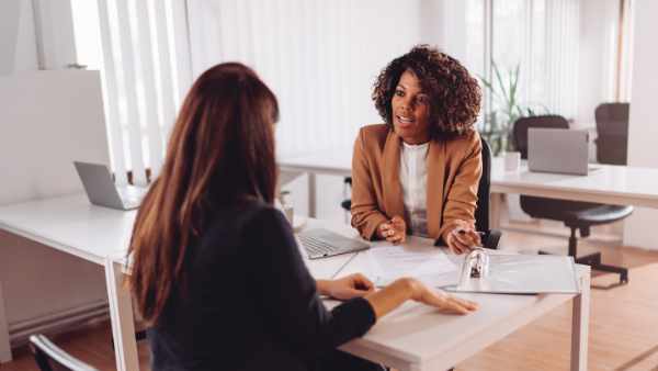 Financial consultant manager talking with a female client